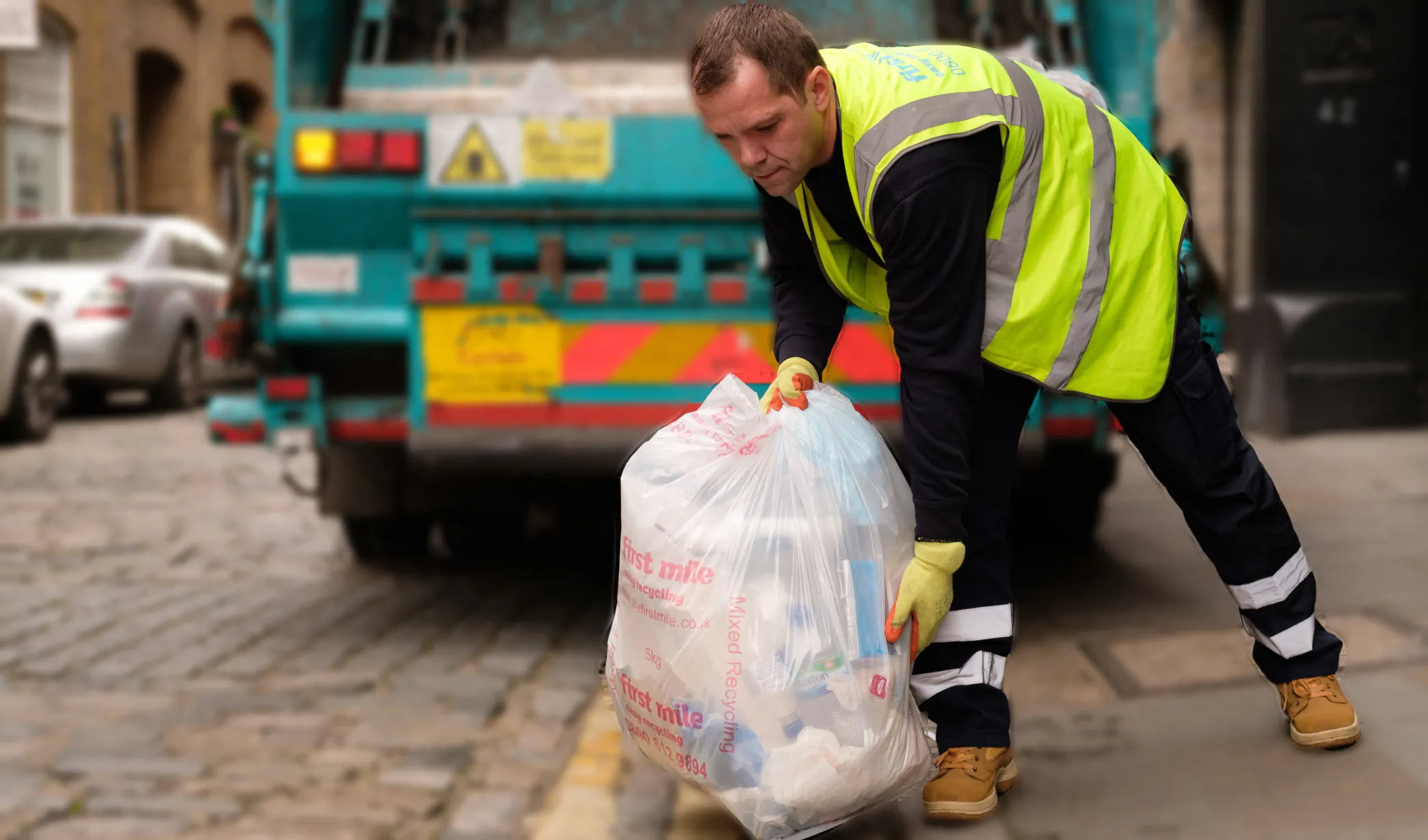 Driver taking away rubbish bags