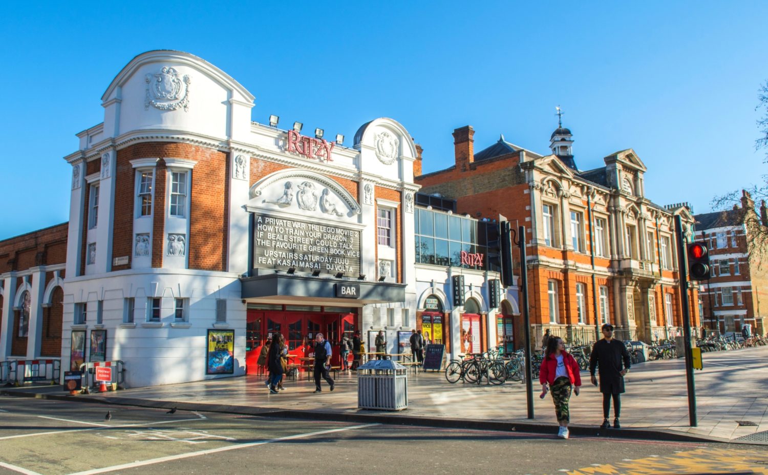 Cinema building and people passing by