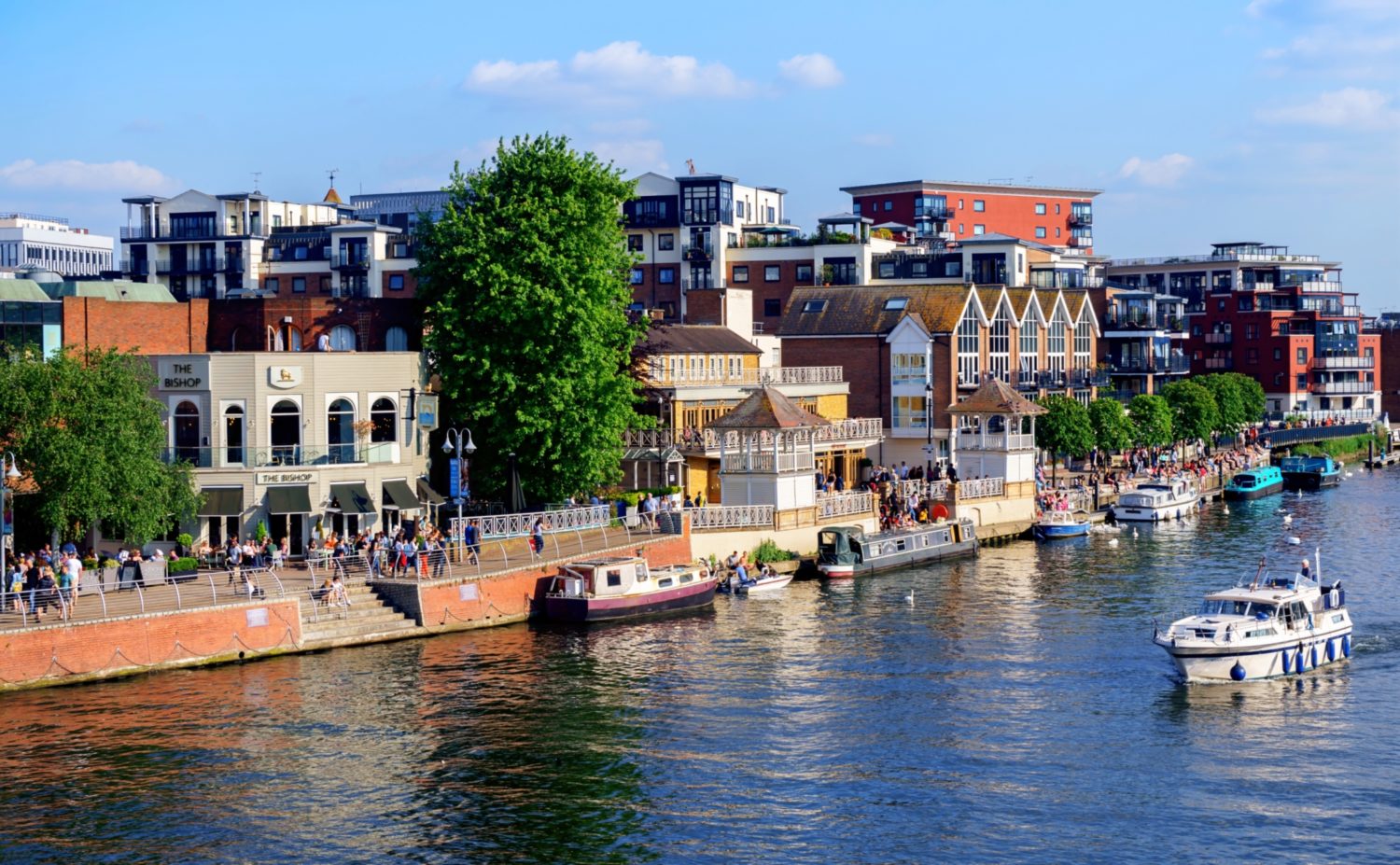 Colourful buildings beside a river