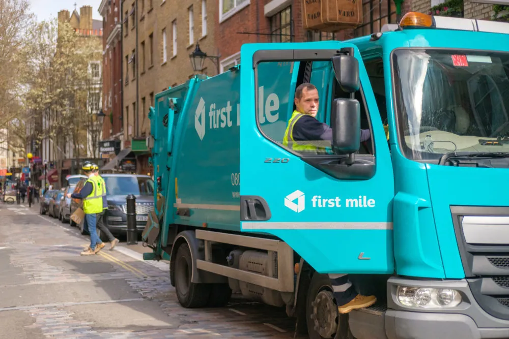 First Mile bin worker and truck at work