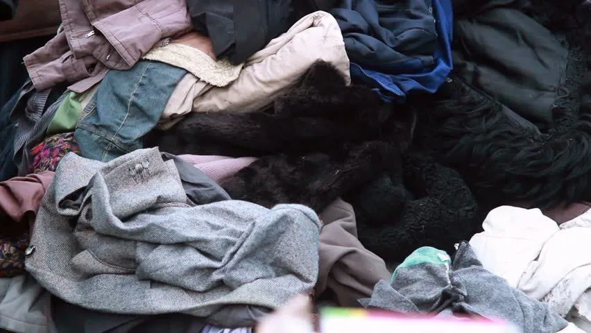 A photograph of a jumbled pile of clothing