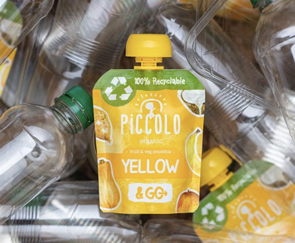 Piccolo smoothie placed on empty plastic water bottles
