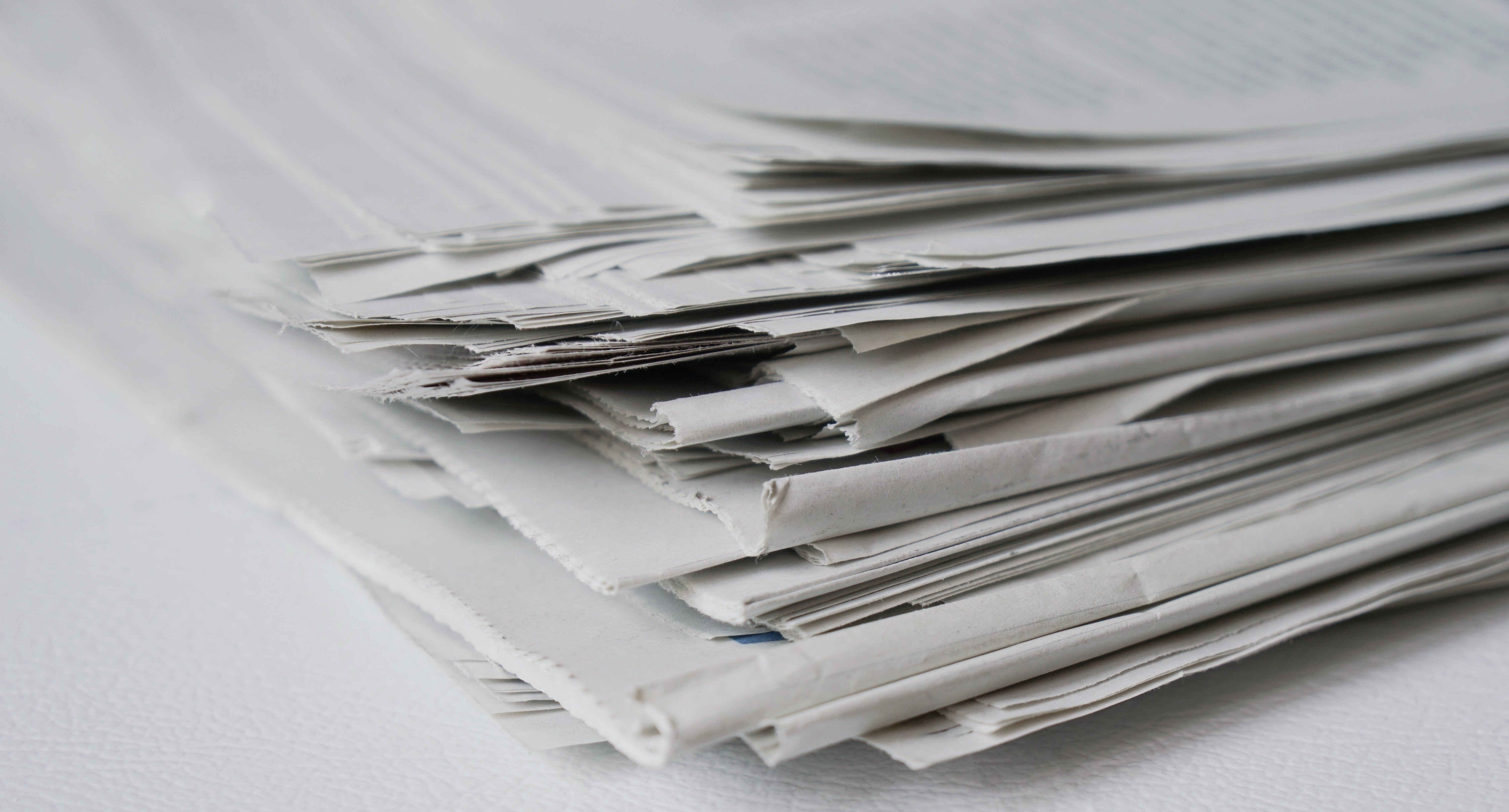 Close-up of a pile of newspapers, showcasing waste that can be recycled
