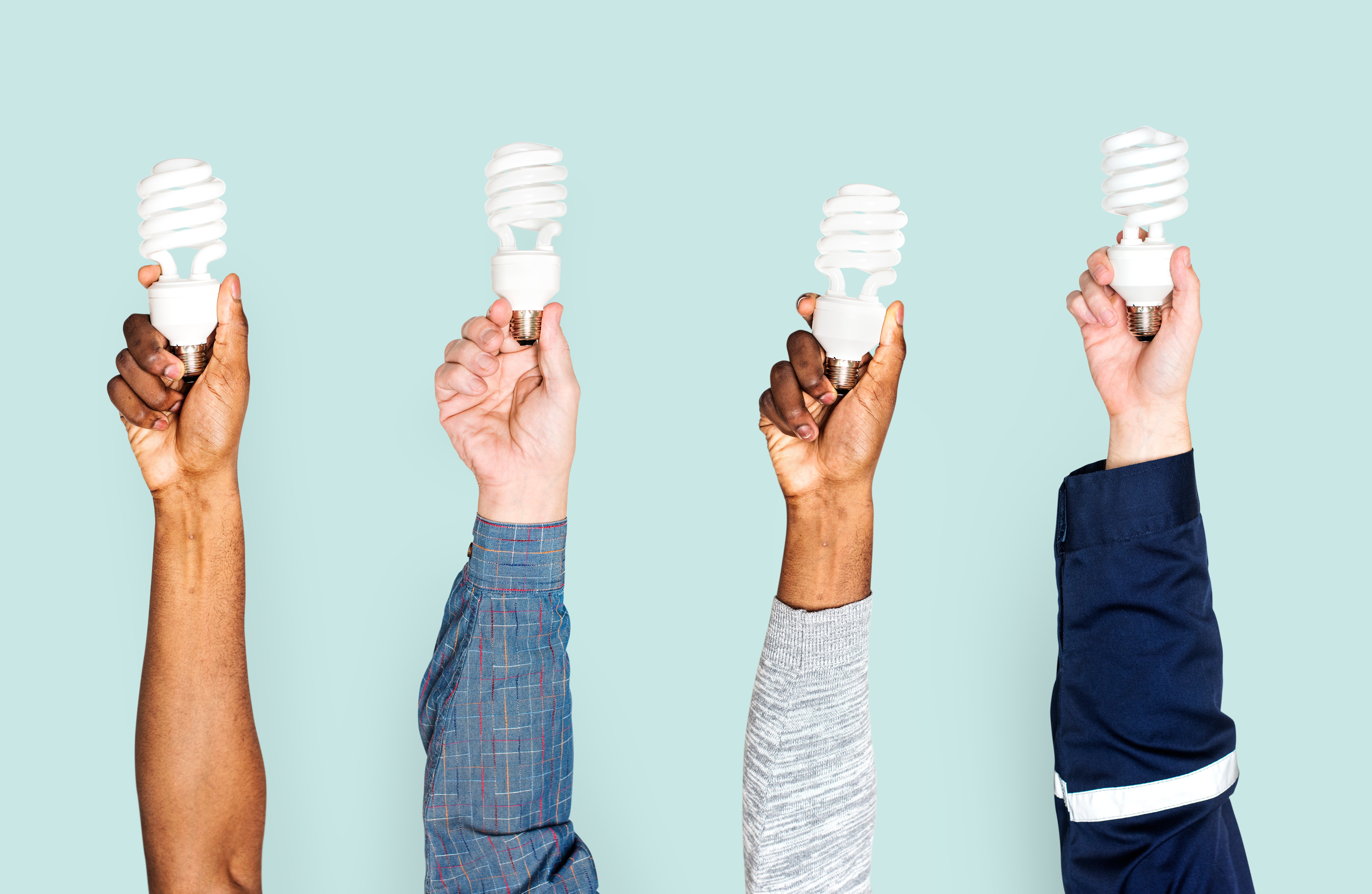 Hands holding LED lights, symbolizing sustainable energy choices