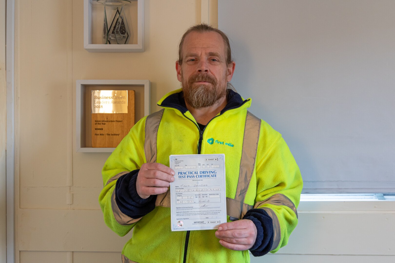 First Mile worker with a practical driving test pass certificate