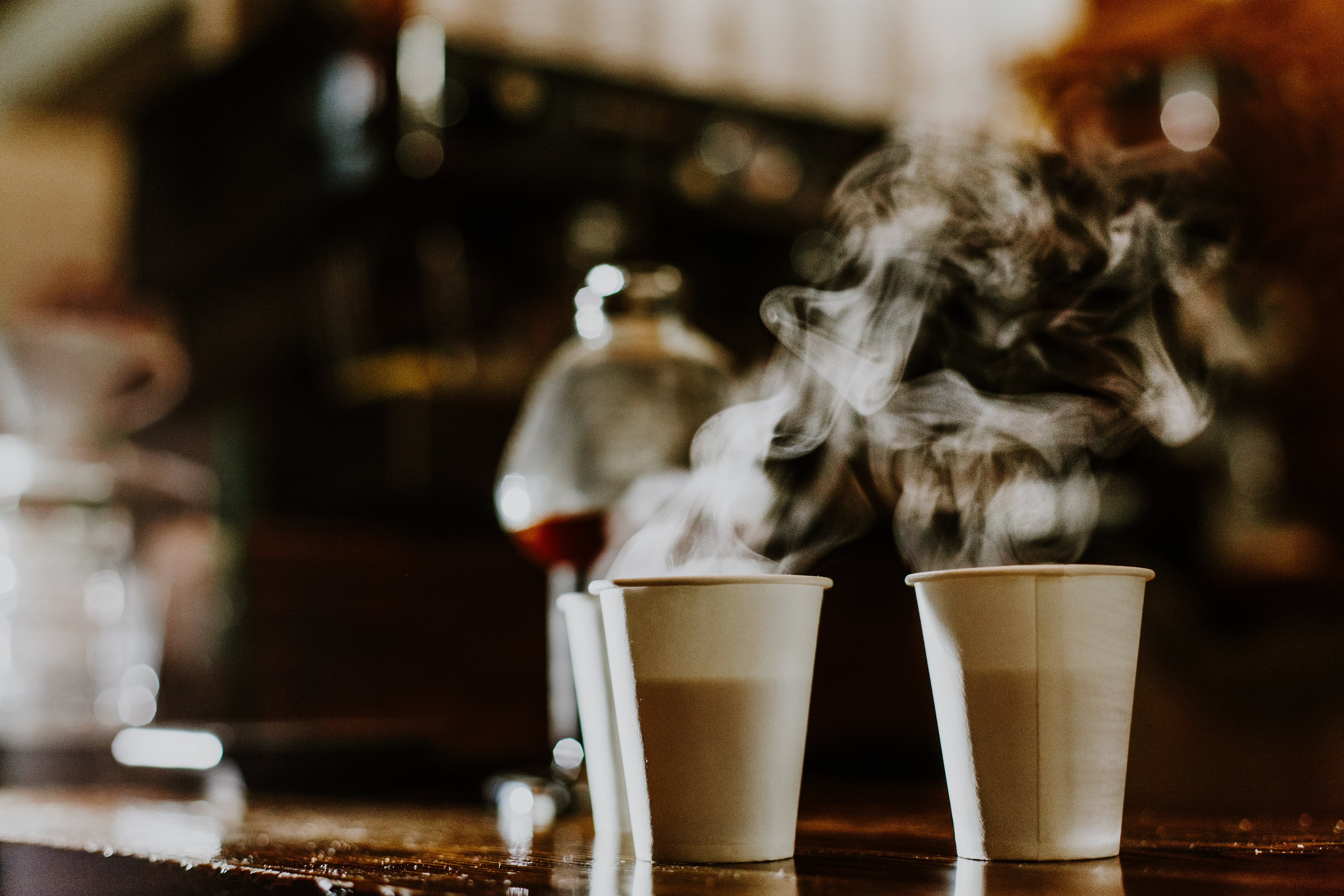 Disposable coffee cup on a table, showcasing the waste problem with single-use items