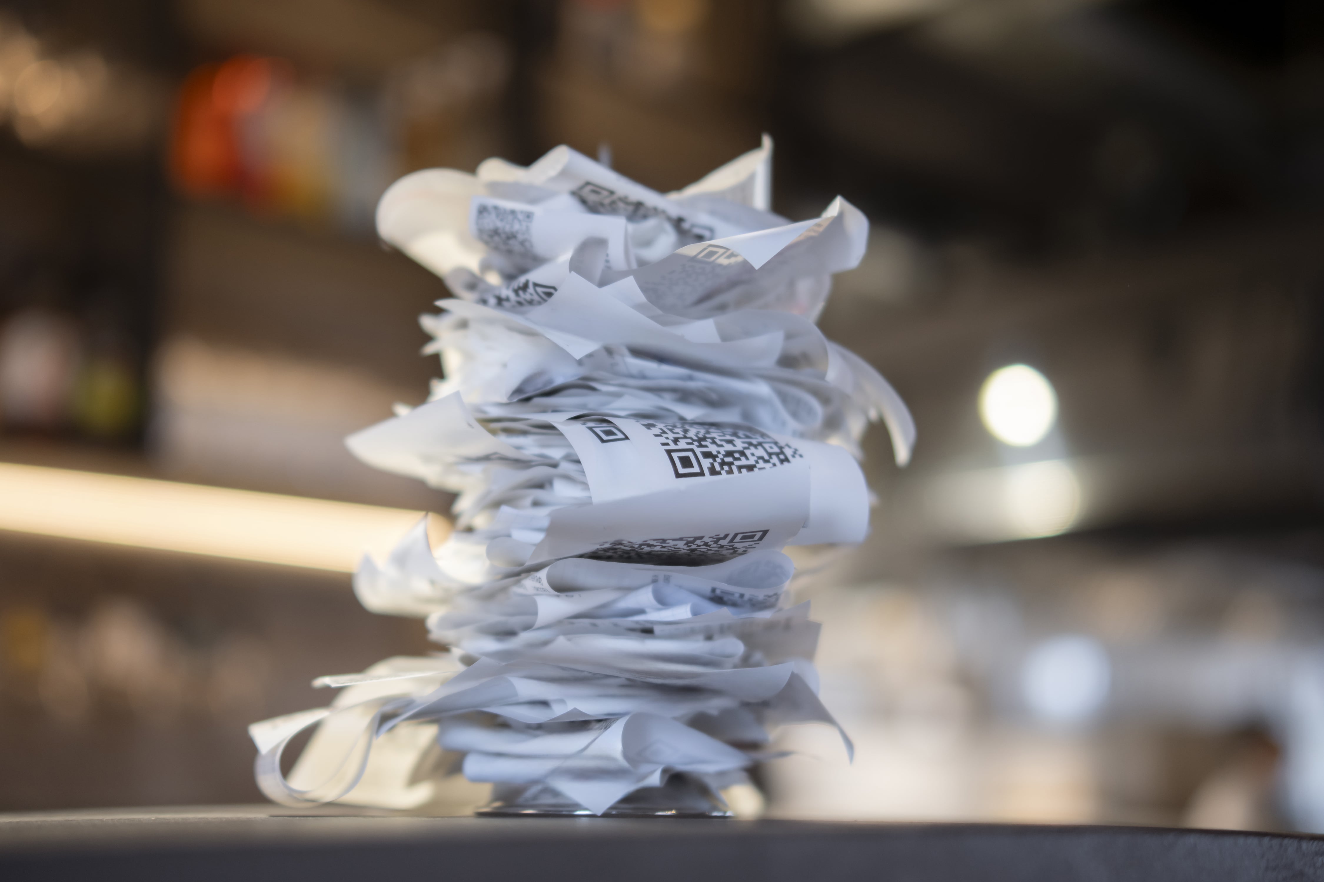 A pile of old paper receipts