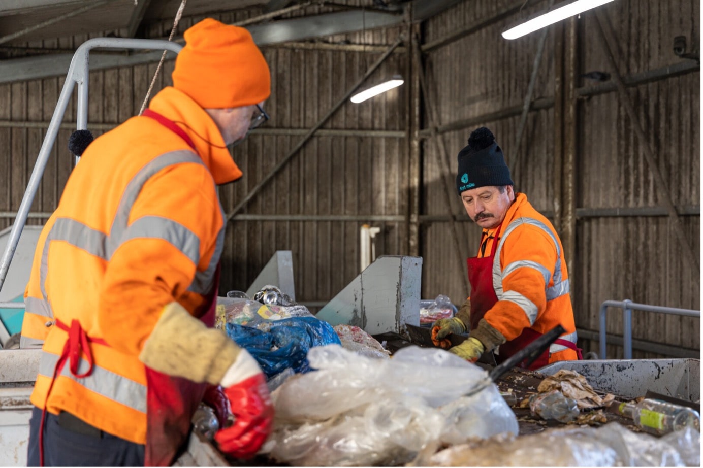 Workers sorting materials at Sacktory waste management facility