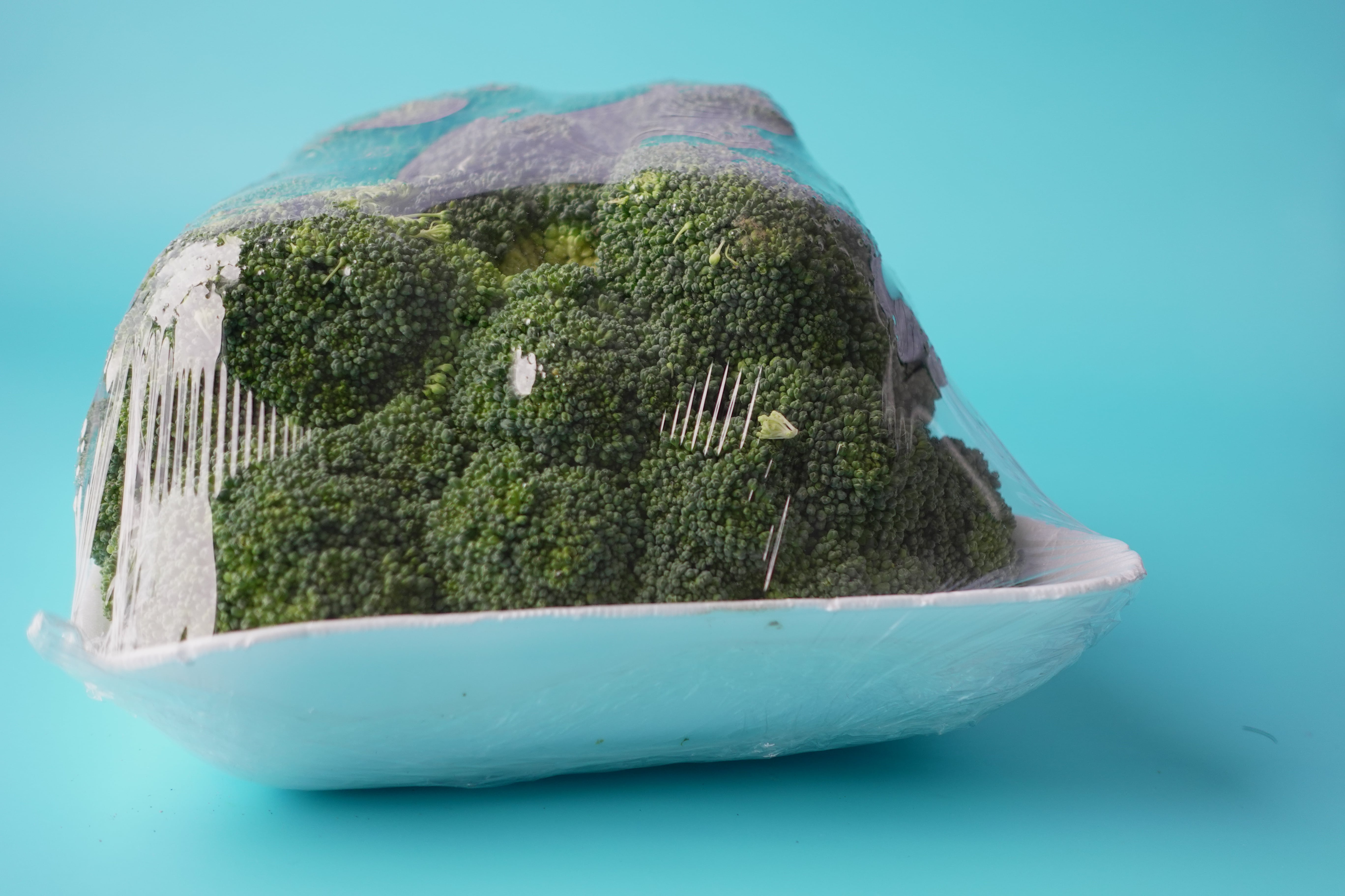 Close-up of fresh broccoli inside eco-friendly packaging