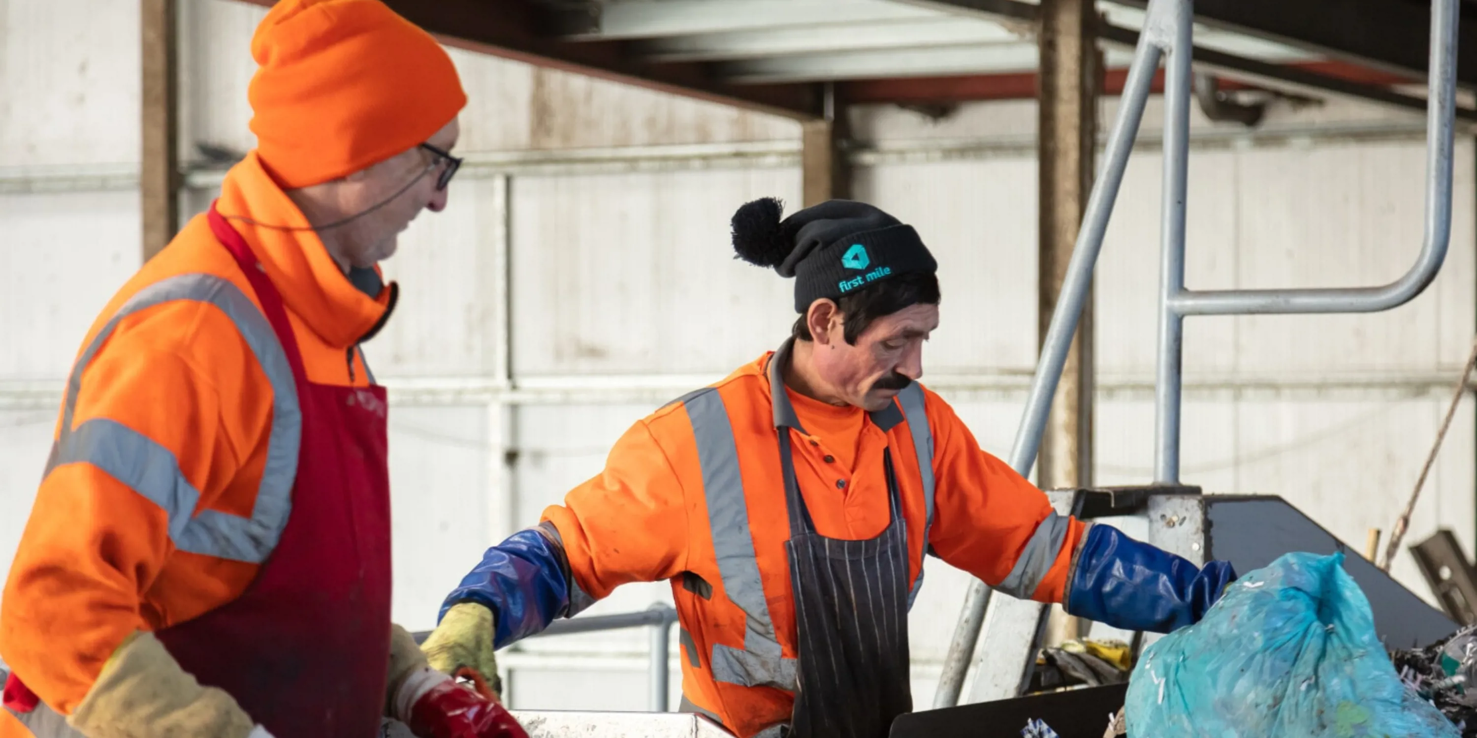 First Mile workers sorting through digital waste